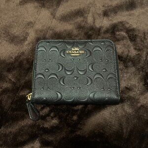 Coach Signature Canvas Embossed Black Zip Around Wallet (previously owned)